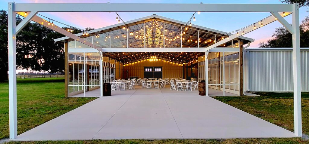 South end of the the big barn pavilion is open to the outdoor dance floor under the string lights. The clear barn enclosure twinkles with all the string lights inside and out.